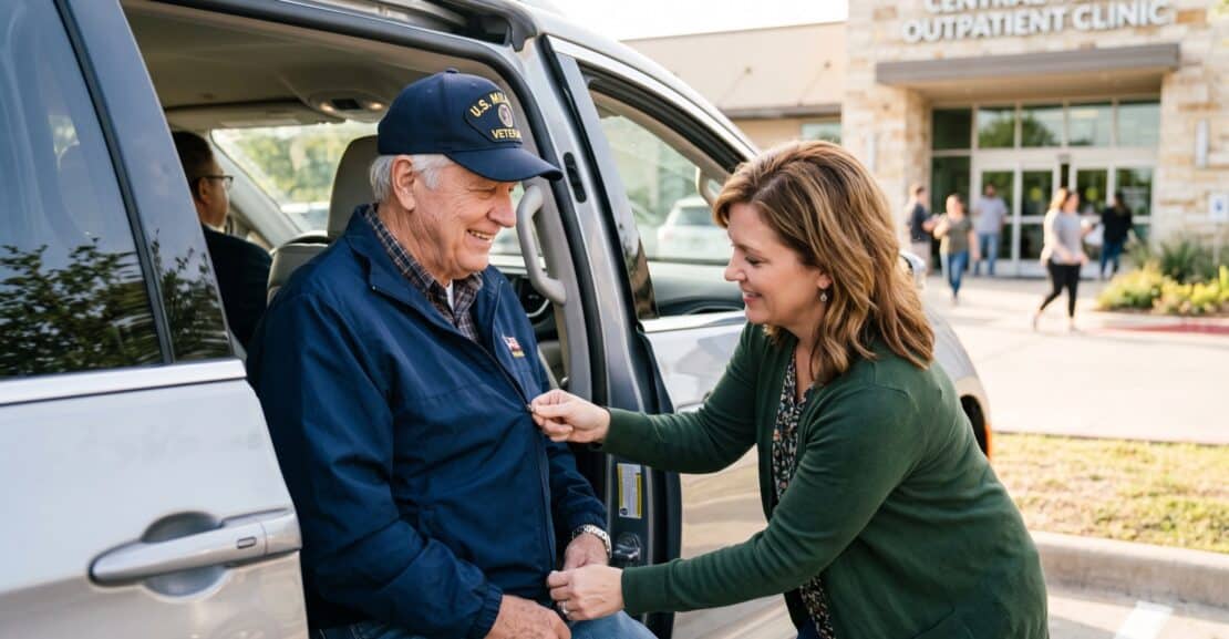 Senior veteran in a veteran cap being helped from a van outside an outpatient clinic
