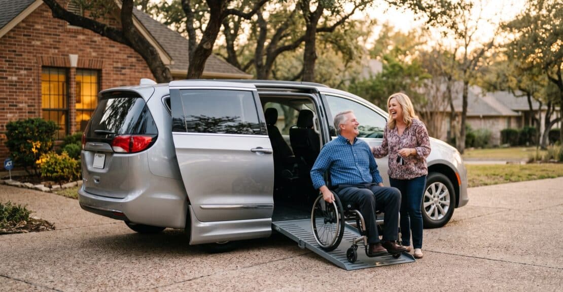 Man in a wheelchair at the ramp of a wheelchair accessible minivan in a Texas driveway, talking with his wife