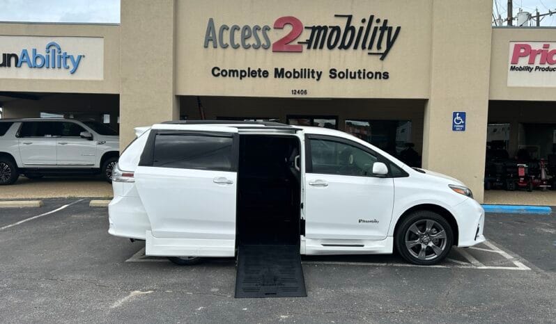 2018 Toyota Sienna SE wheelchair van with BraunAbility power fold-out ramp deployed from the passenger side