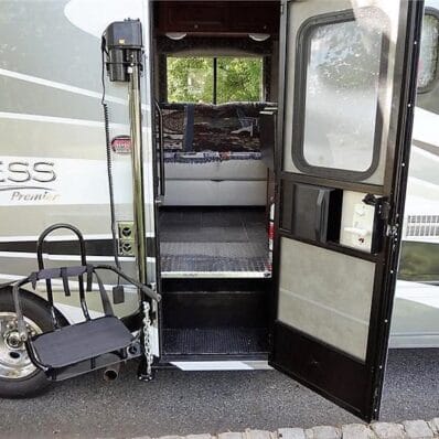 CoachLift RV Lift beside a motorhome entry door