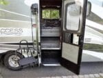 CoachLift RV Lift mounted beside a motorhome entry door