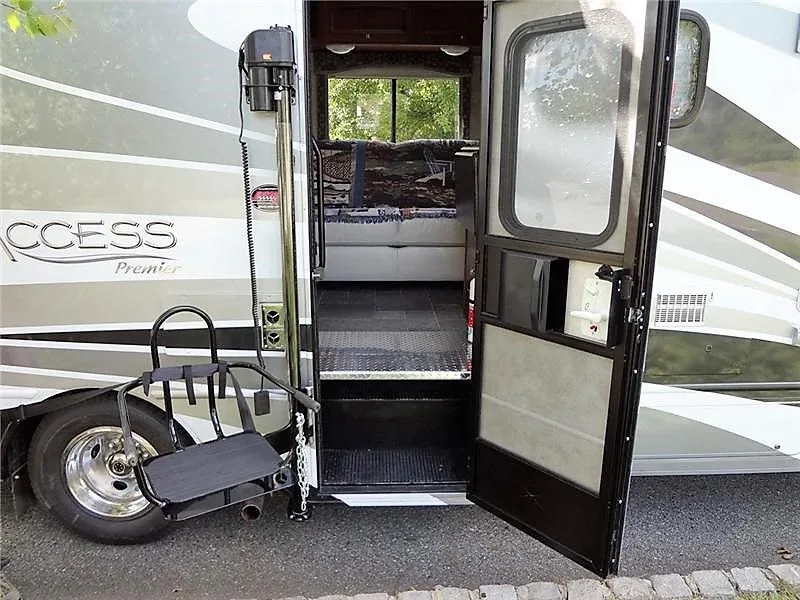 CoachLift RV Lift mounted beside a motorhome entry door